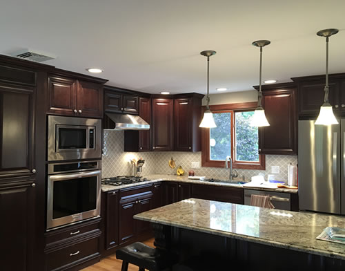 Picture of a remodeled kitchen with new lighting 
